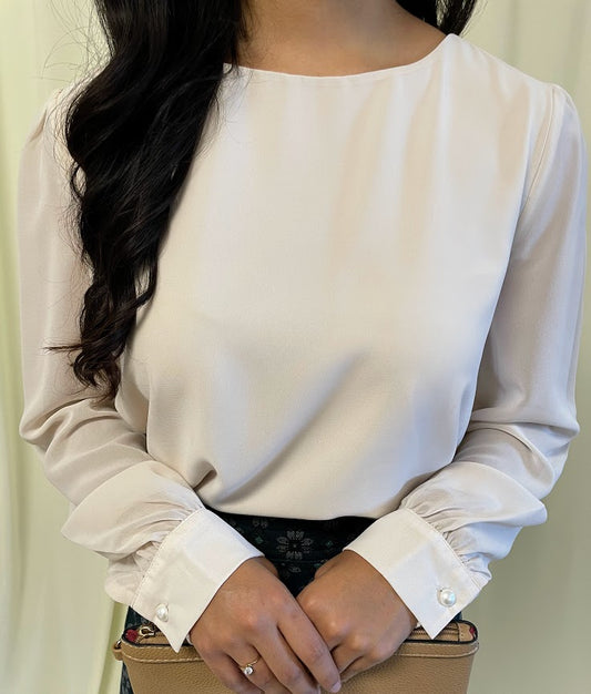 Long Sleeve Chiffon Blouse with Crew Neckline and Pearl Cuffs in Sand Beige