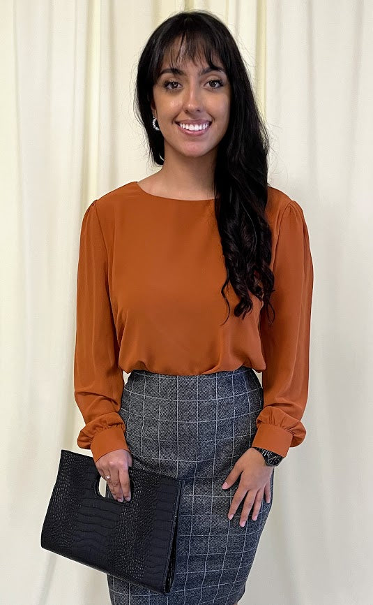 Long Sleeve Chiffon Blouse with Crew Neckline and Pearl Cuffs in Burnt Orange